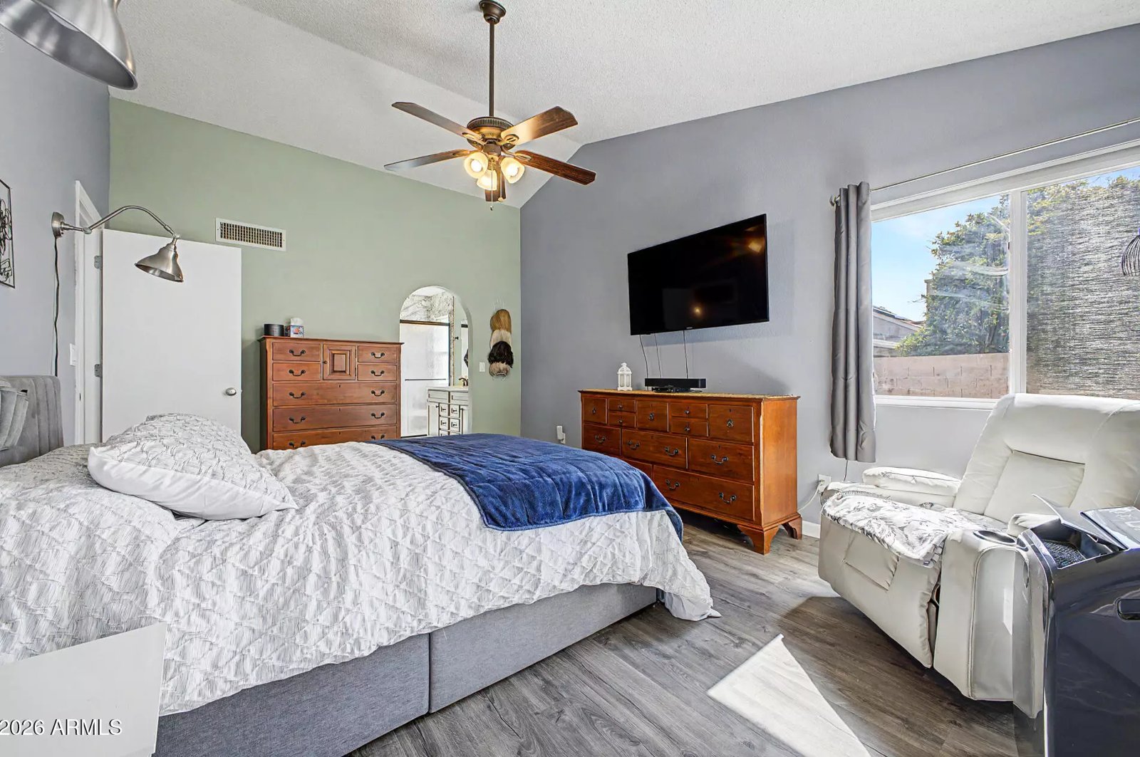 Primary bedroom with ceiling fan in a Glendale, Arizona brokerage listing